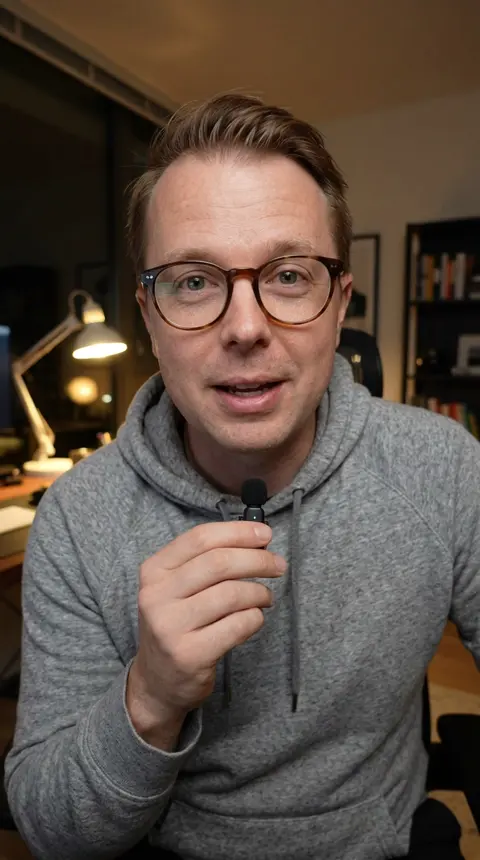 Paul's twin in a dark home office with a lamp